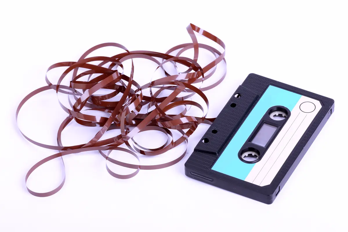 A cassette with a long length of loose magnetic tape